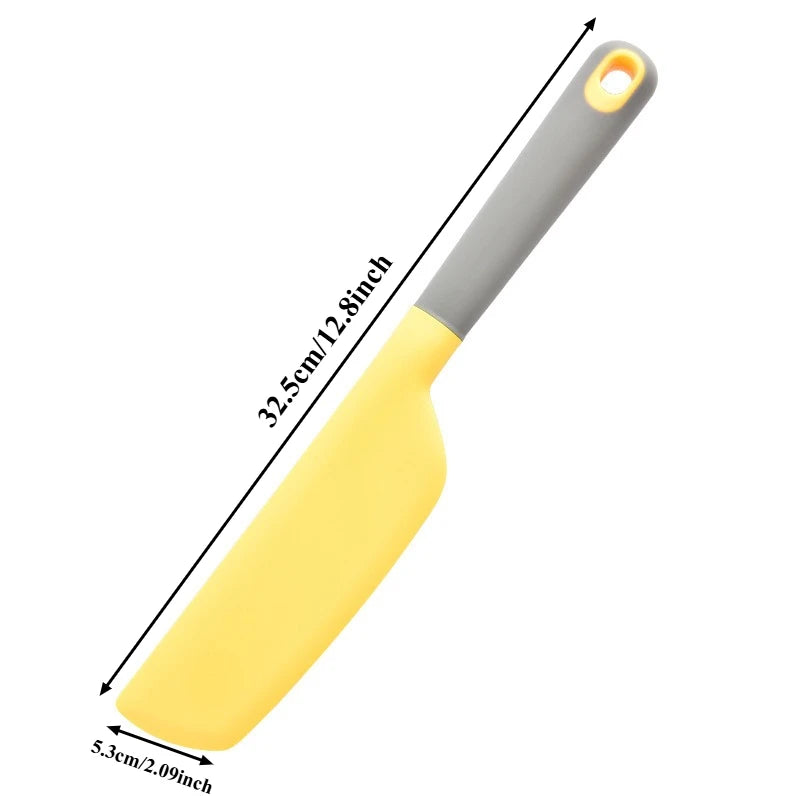 Yellow spatula with gray handle and measurements on a white background