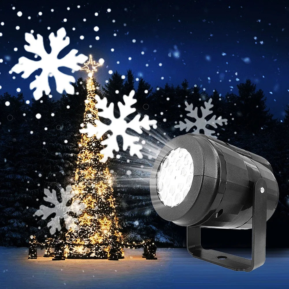 Black light projector with a mounting bracket beside an illuminated outdoor Christmas tree, with white snowflakes and spots against the night sky.