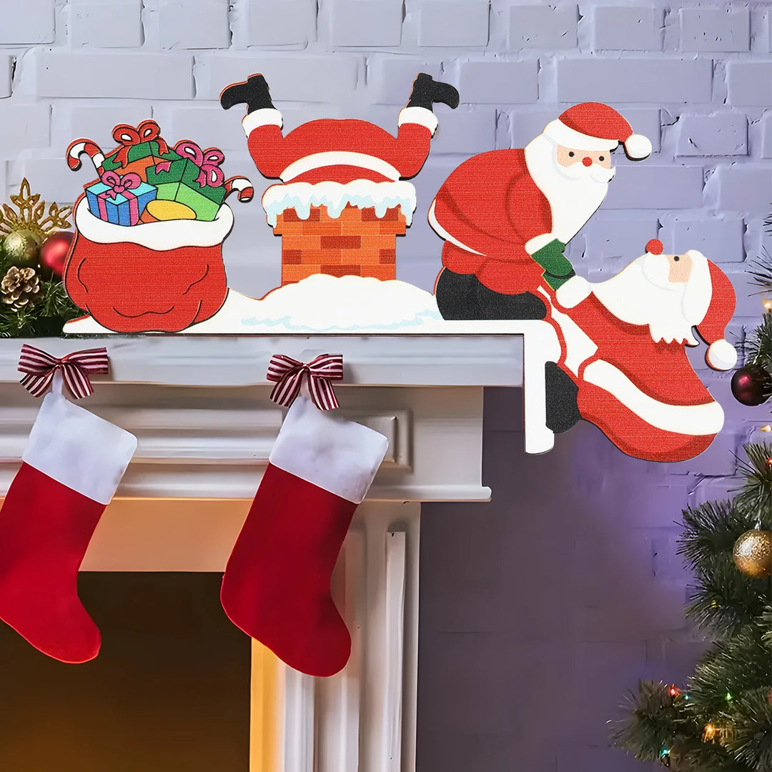Red and white Santa door corner decoration with a snowy chimney and gift sack sits on a white mantel above red stockings.