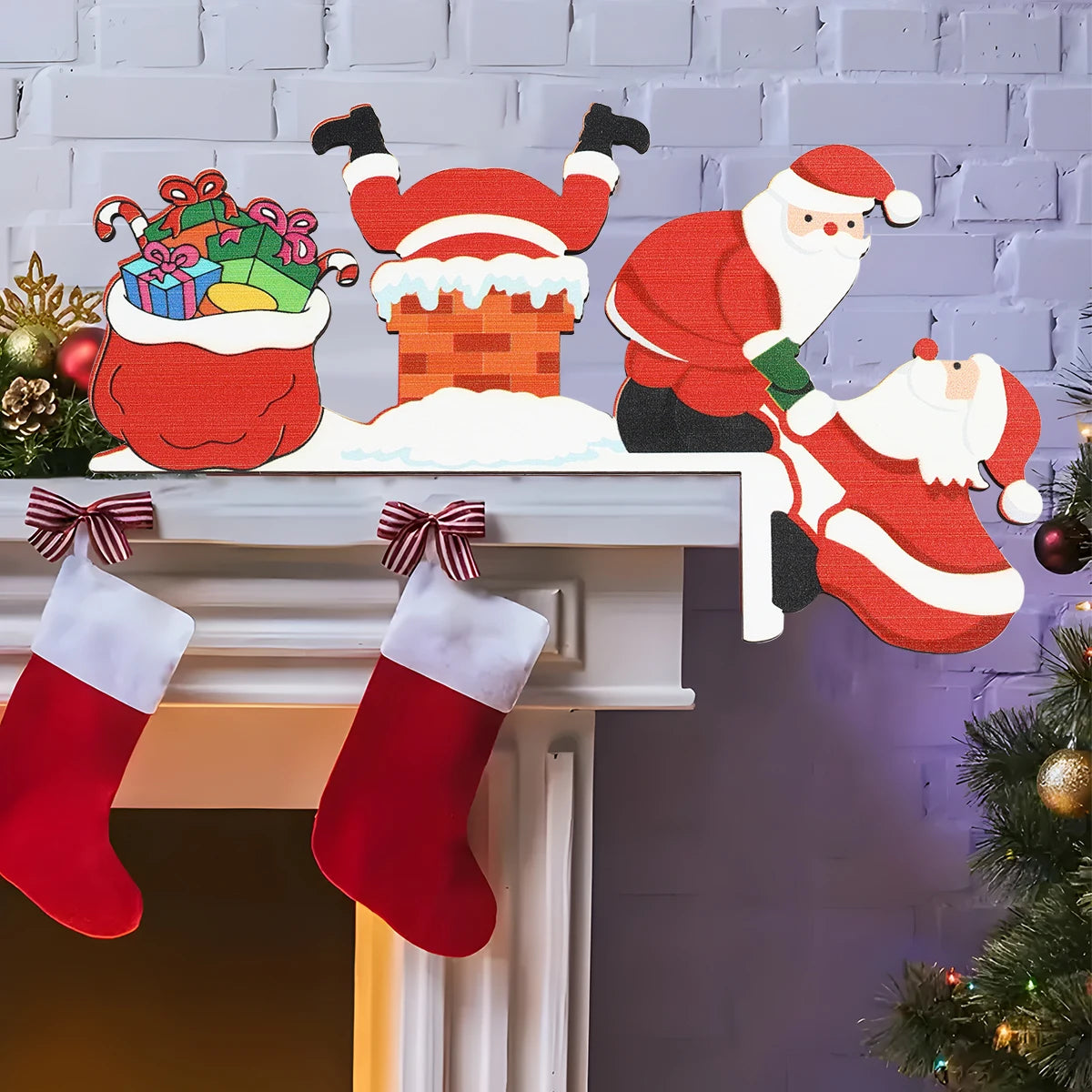 Red and white Santa door corner decoration with a snowy chimney and gift sack sits on a white mantel above red stockings.