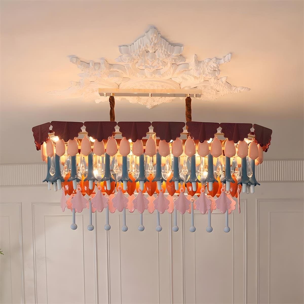 Decorative chandelier with colorful glass shades on a neutral background
