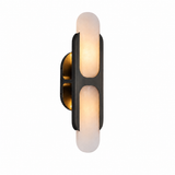 Wall sconce with dark metal frame and two frosted white glowing shades on a plain white background
