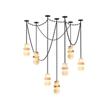 Decorative chandelier with chains and wooden beads on a white background