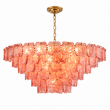 Illuminated chandelier with tiered pink textured glass panels and a gold chain and ceiling canopy against a white background.