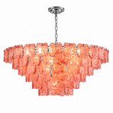 Illuminated chandelier with tiered pink textured glass panels and a silver chain and ceiling canopy against a white background.