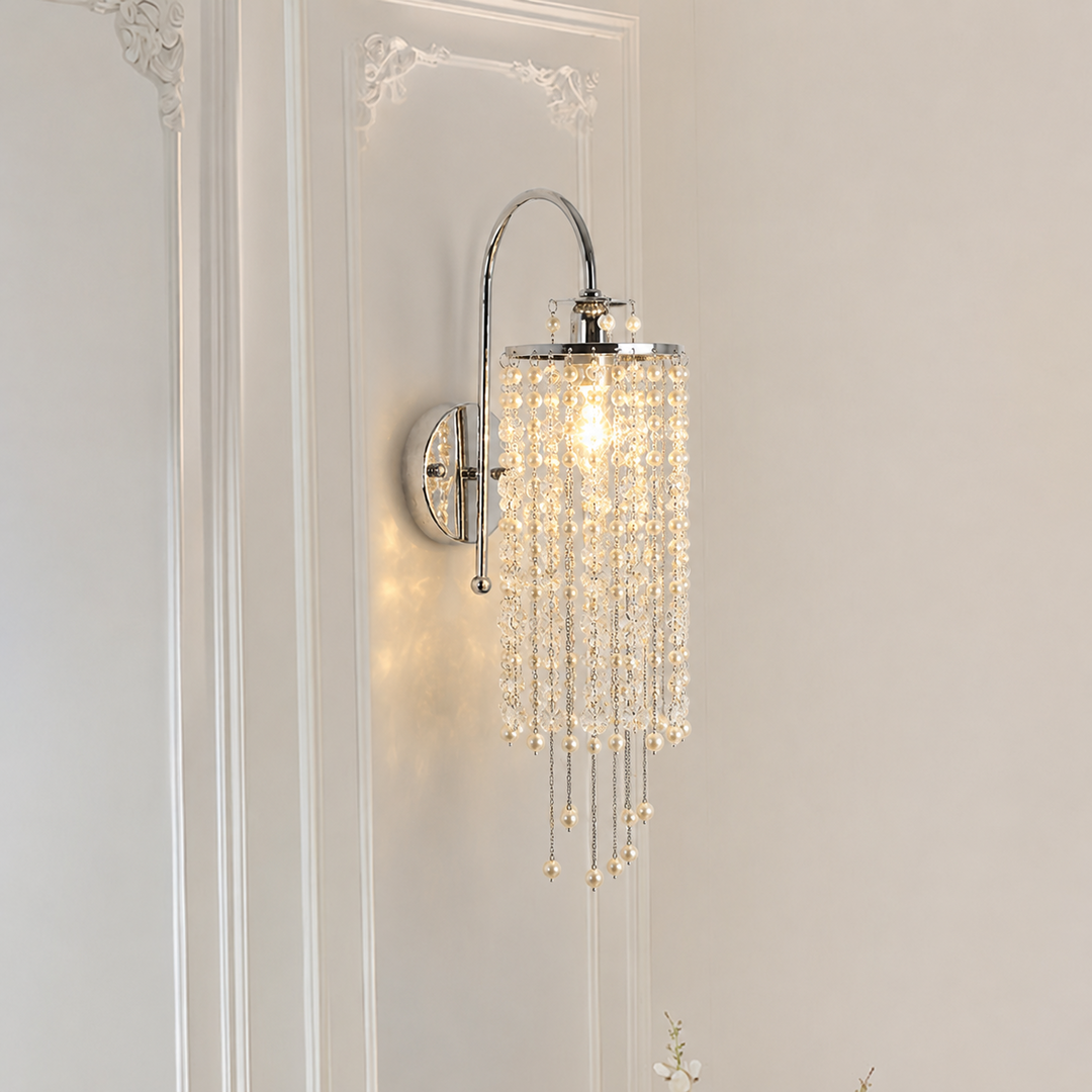 Decorative wall sconce with crystal accents on a neutral wall.
