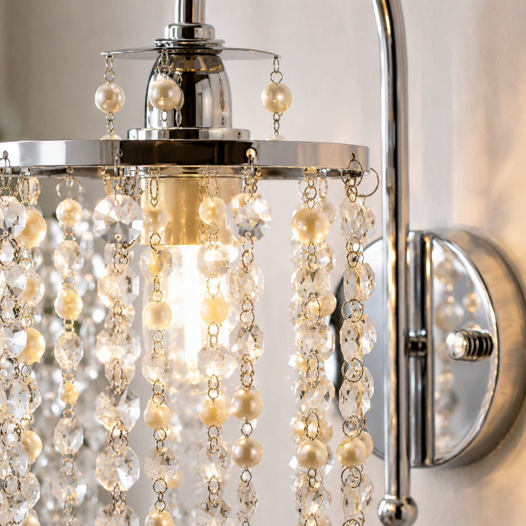 Decorative wall sconce with crystal and pearl accents on a neutral background