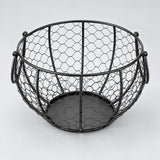 Empty black wire egg basket showing its open top and solid base.