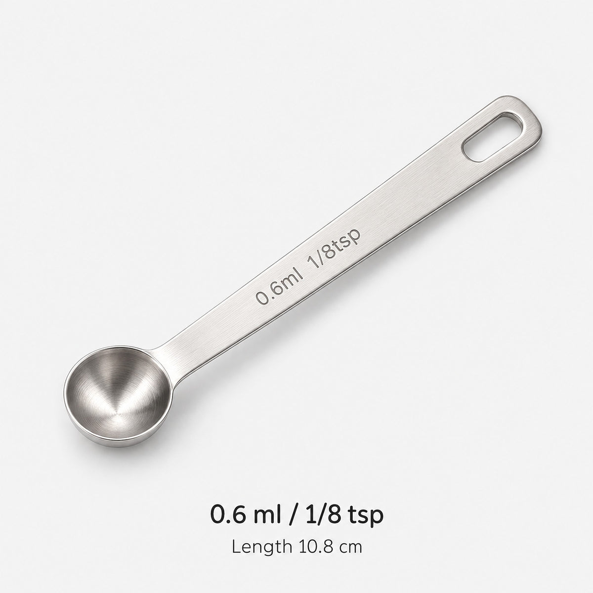 Stainless-steel 0.6 ml / 1/8 tsp measuring spoon, 10.8 cm long.