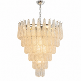 A modern tiered chandelier featuring textured clear glass teardrop-shaped drops on a polished silver metal frame, suspended by a chain against a plain white background.
