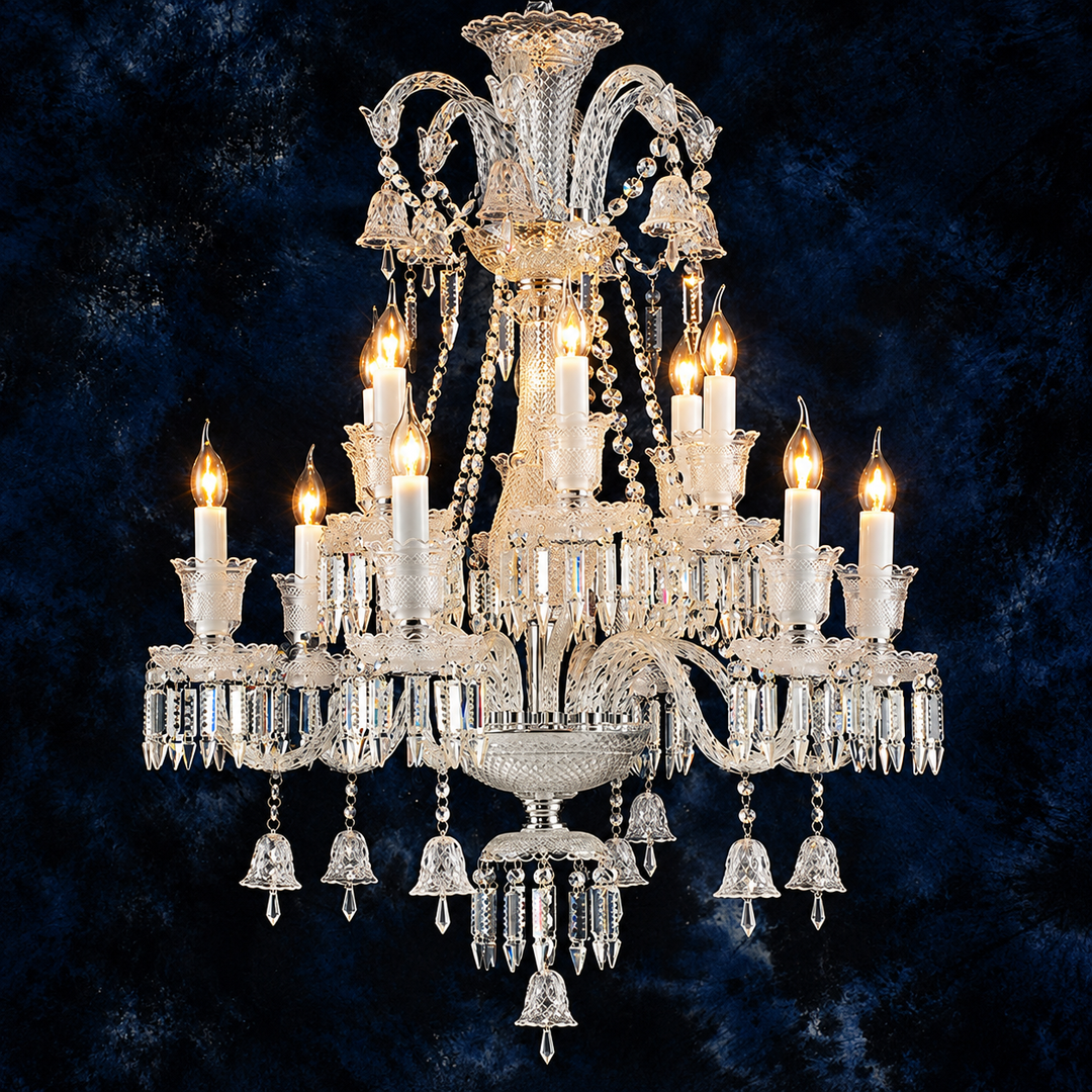 An ornate crystal chandelier with multiple candle-style lights turned on, set against a dark textured blue background.