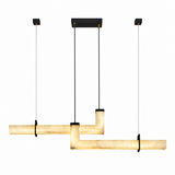 A modern multi-light linear pendant chandelier with a warm cream marble-look glass shade and black metal hardware, suspended against a plain white background.