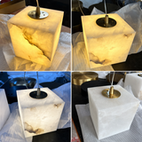 Four-panel collage showing chandelier cube shades with alabaster veining and gold-toned fittings, illuminated and unlit on protective wrapping.