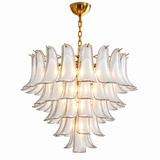 A modern multi-tiered chandelier featuring clear glass bell-shaped shades with a brushed gold metal frame, chain, and ceiling canopy, shown against a plain white background.