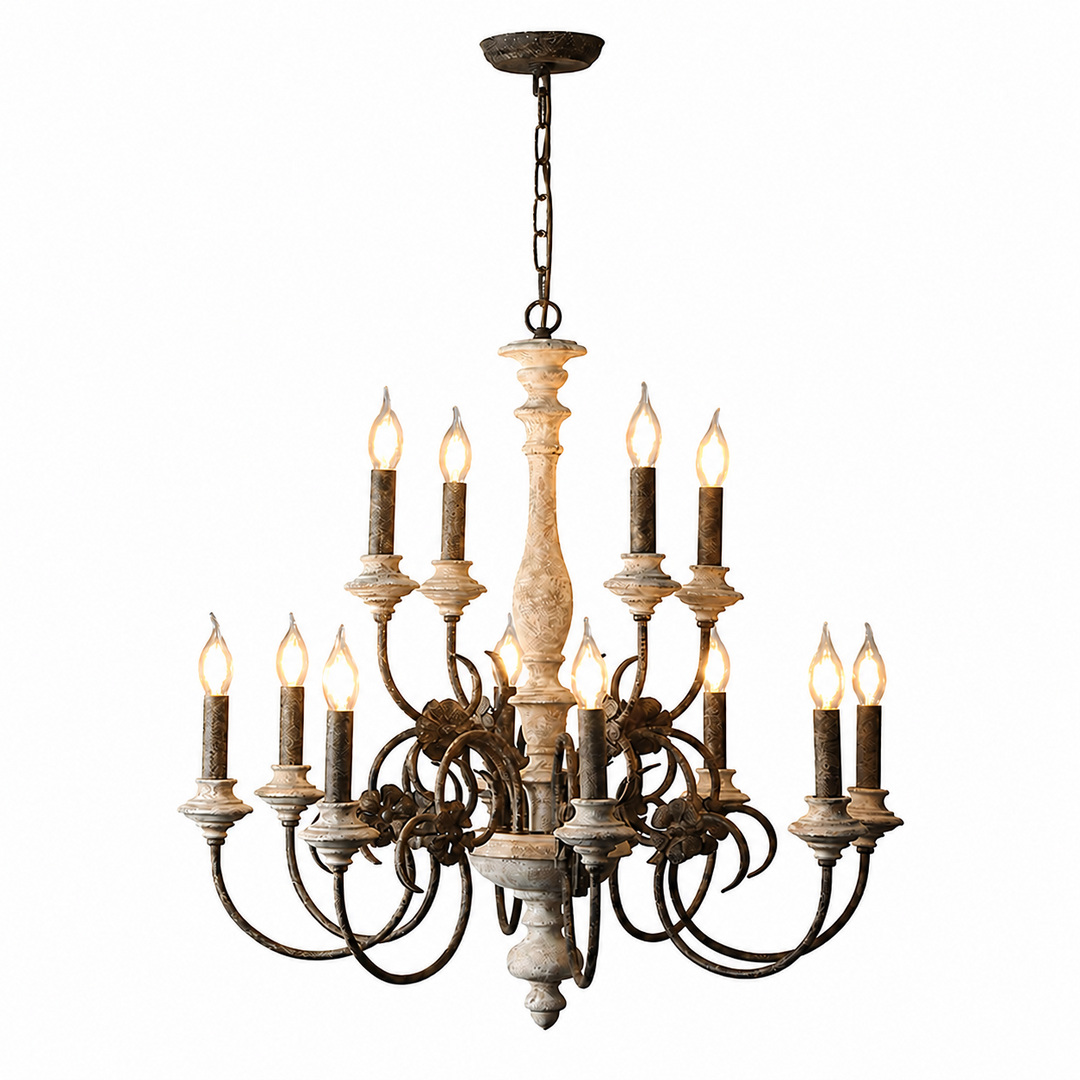 Two-tier chandelier with a distressed cream central column, dark curved arms, and glowing candle-shaped bulbs suspended by a chain against white.