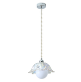 Pendant light with gold fixture and white glass shade on a white background