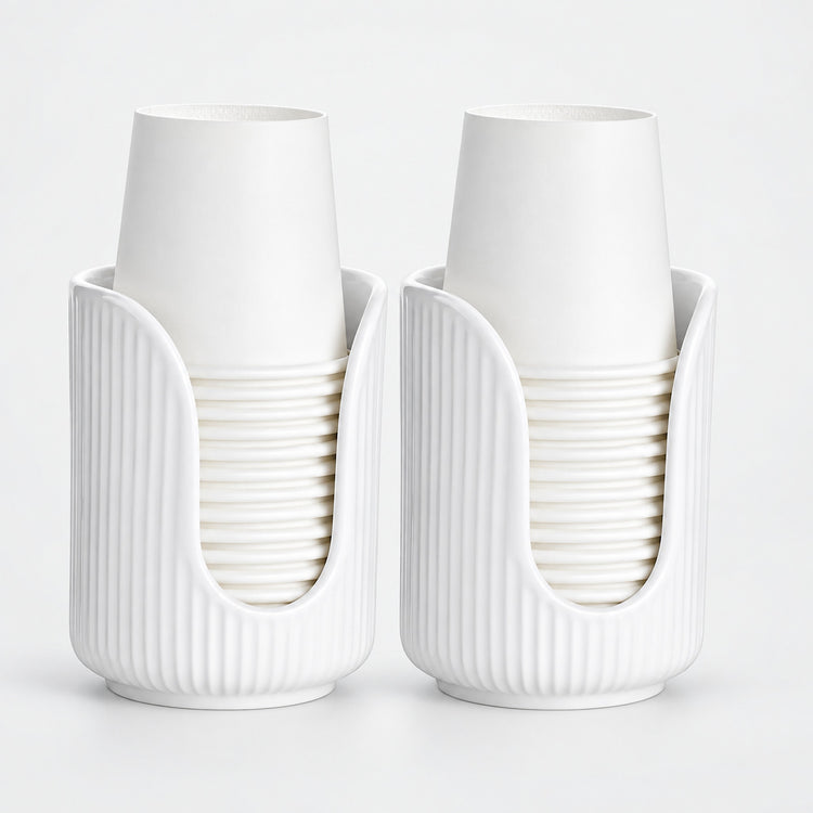 Two white ribbed cup holders, each holding a stack of white paper cups, photographed on a clean white background.