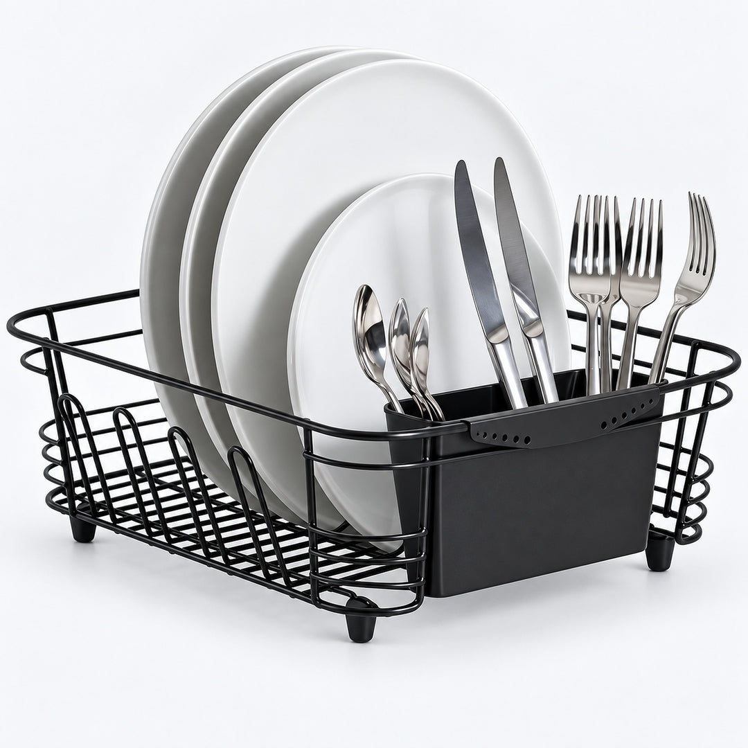Black wire dish drying rack with a black plastic drain tray and utensil holder, shown with white plates and silver cutlery on a white background.