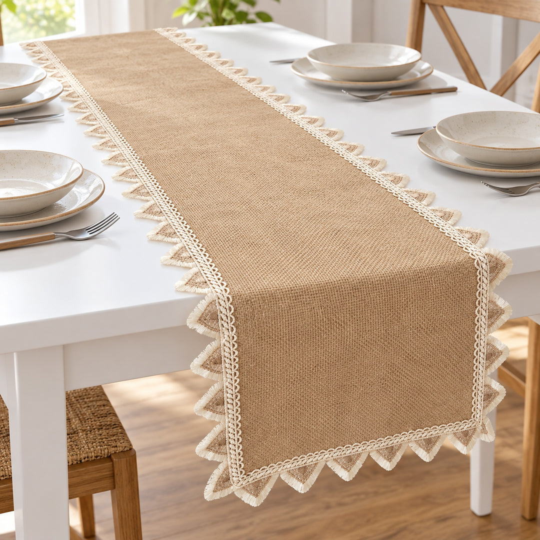 Tan runner with cream triangle trim on a dining table.