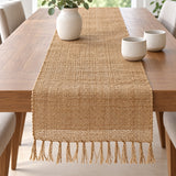 Jute table runner with knotted fringe on a dining table; props not included.
