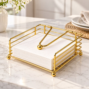Decorative metal napkin holder keeping napkins tidy on a dining table