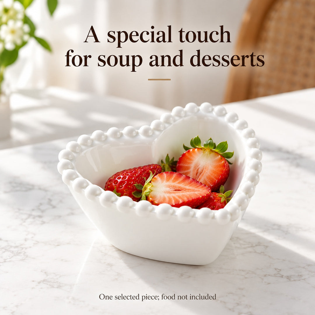 White heart-shaped ceramic bowl with pearl-style rim serving strawberries; one selected piece.