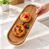 Large oval wood tray used to serve pastries and berries; food not included.