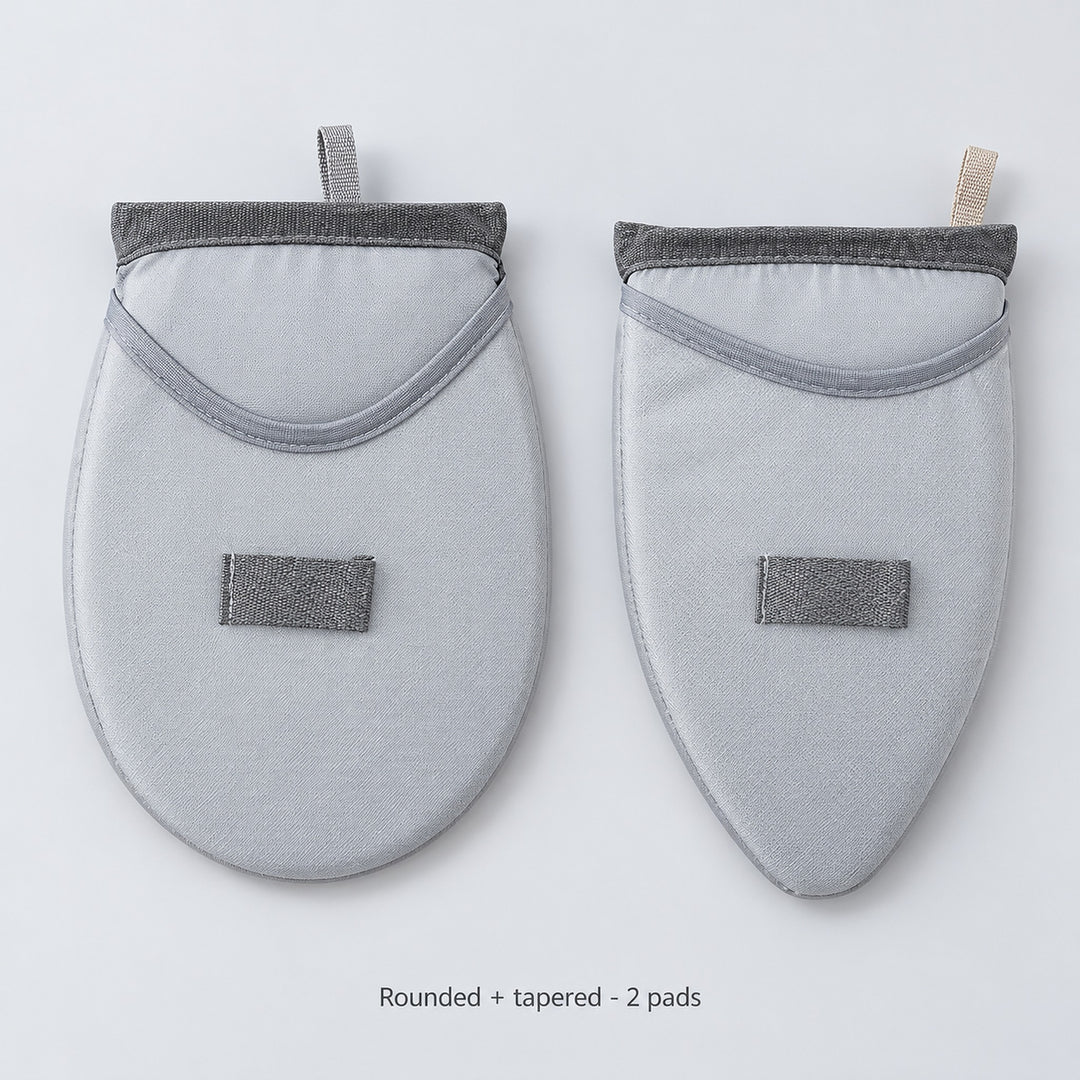 Two garment-steaming pads, one rounded and one tapered.