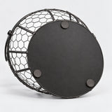 Black iron egg basket underside with three flat non-slip pads.