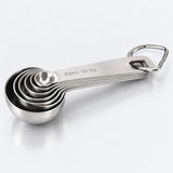 Six stainless-steel measuring spoons nested together on an opening metal ring.
