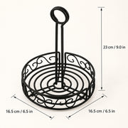 Black metal wire stand with a circular base and upright loop handle, shown with dimension arrows and labels indicating 23 cm height and 16.5 cm width on a light beige background.