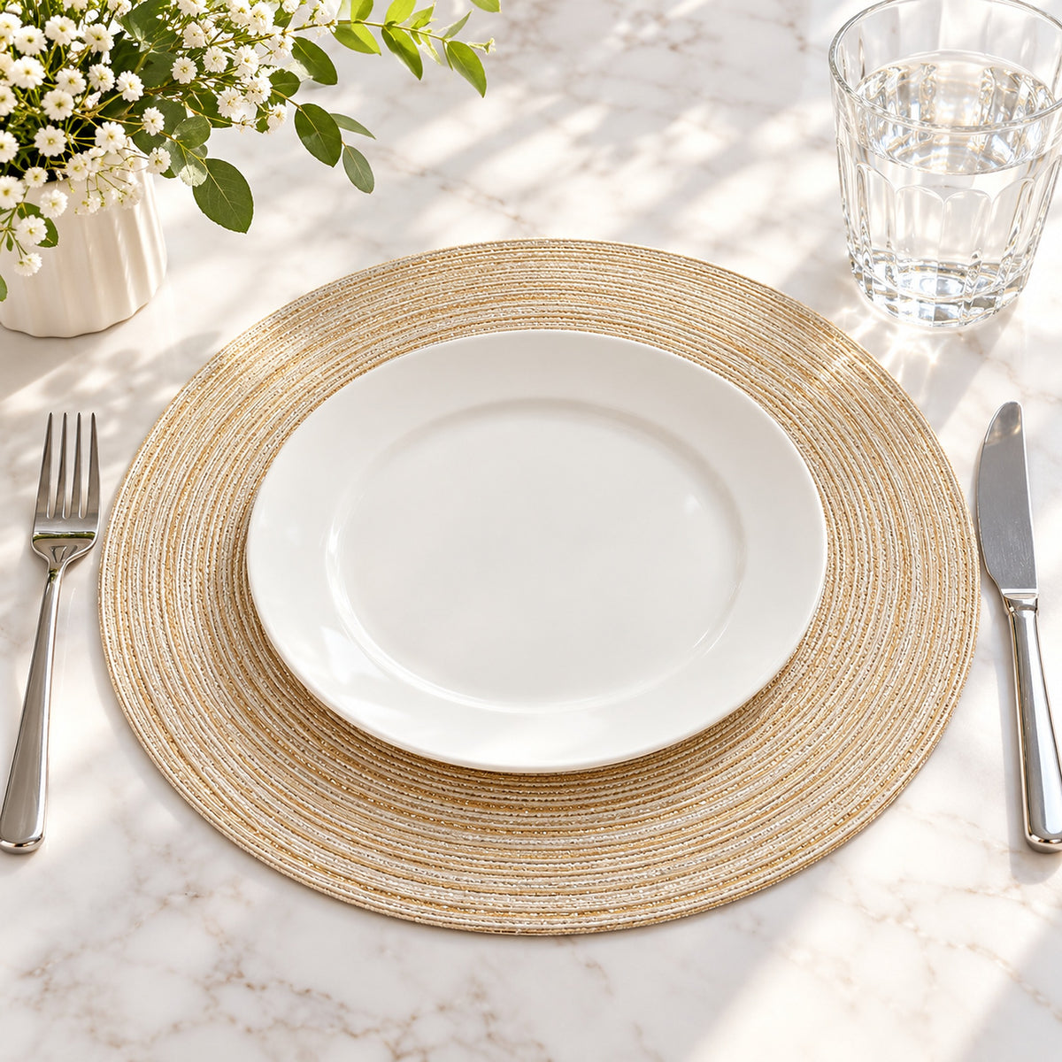 Beige round mat under a plate at a dining place setting.