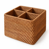 Square wicker basket showing four separate compartments and woven cross-divider.