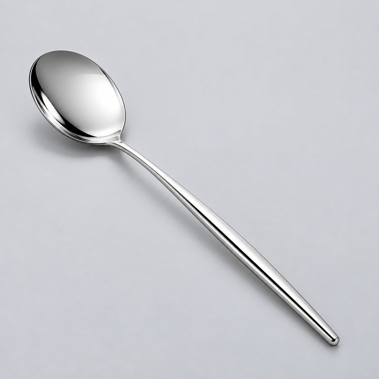 Silver dinner spoon showing its polished bowl and slim metal handle.