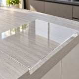 Transparent acrylic prep surface with an integral lip fitted over the countertop edge.