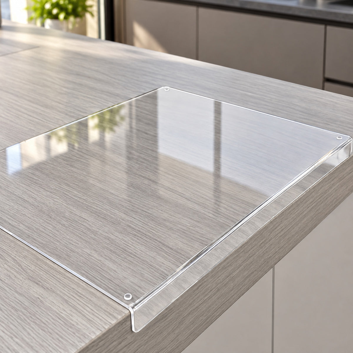 Transparent acrylic prep surface with an integral lip fitted over the countertop edge.