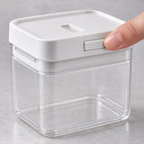 Close-up of the white container lid, front latch and fitted inner rim.