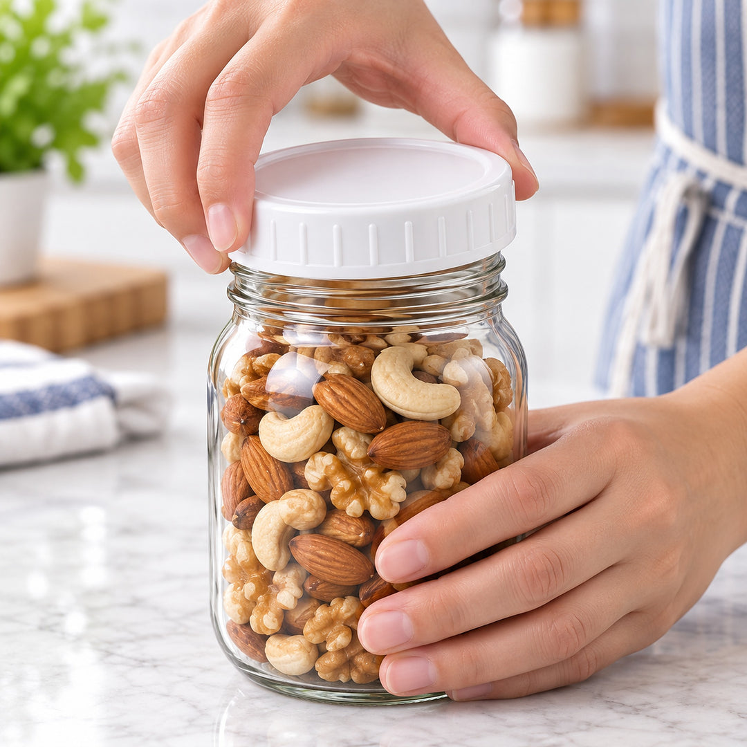 Hand gripping the ribbed white lid while closing a mason jar.