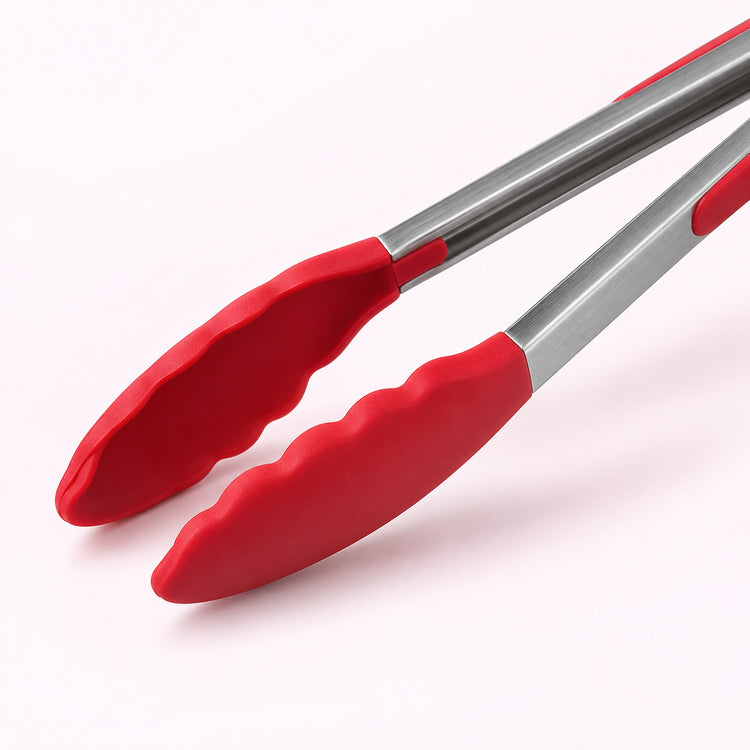 Red scalloped silicone tong tips and stainless steel arms.