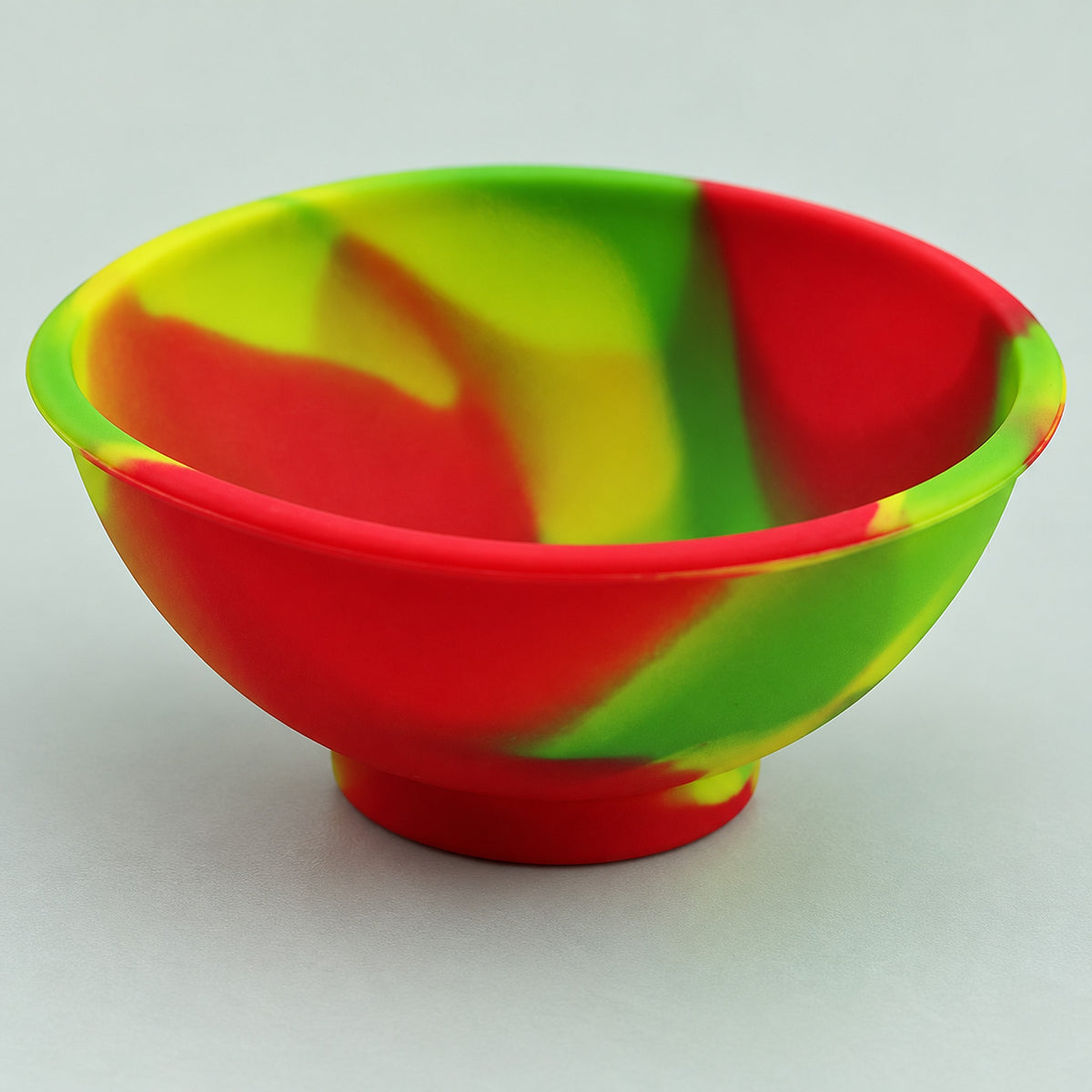 Mini silicone bowl with rolled rim and integral pedestal base.