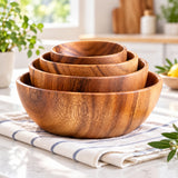 Handmade acacia wood bowls showing warm natural grain and useful size range