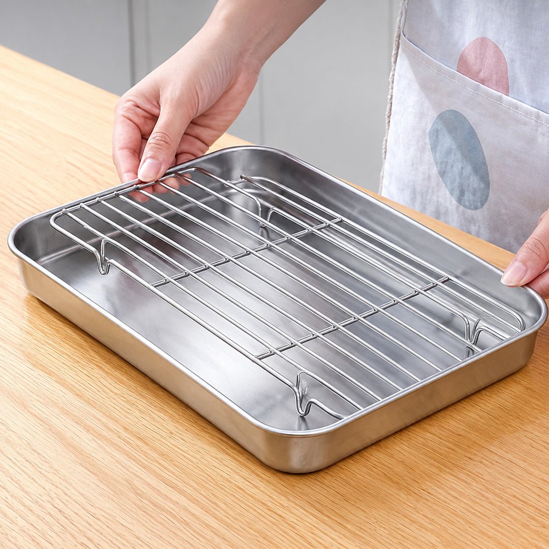 Hand lifting the removable rack to reveal raised feet and the tray below.