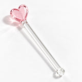 Decorative pink heart fused to a clear glass stirring stem.