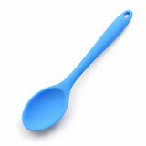 Sky-blue silicone spoon shallow bowl and curved neck detail.