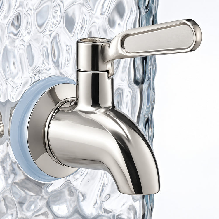 A polished chrome wall-mounted faucet spout with a rectangular lever handle, shown against a textured clear glass background.