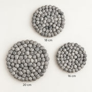 Three round gray felt coasters with a textured bumpy surface, shown on a white background with size labels indicating 18 cm, 20 cm, and 16 cm.