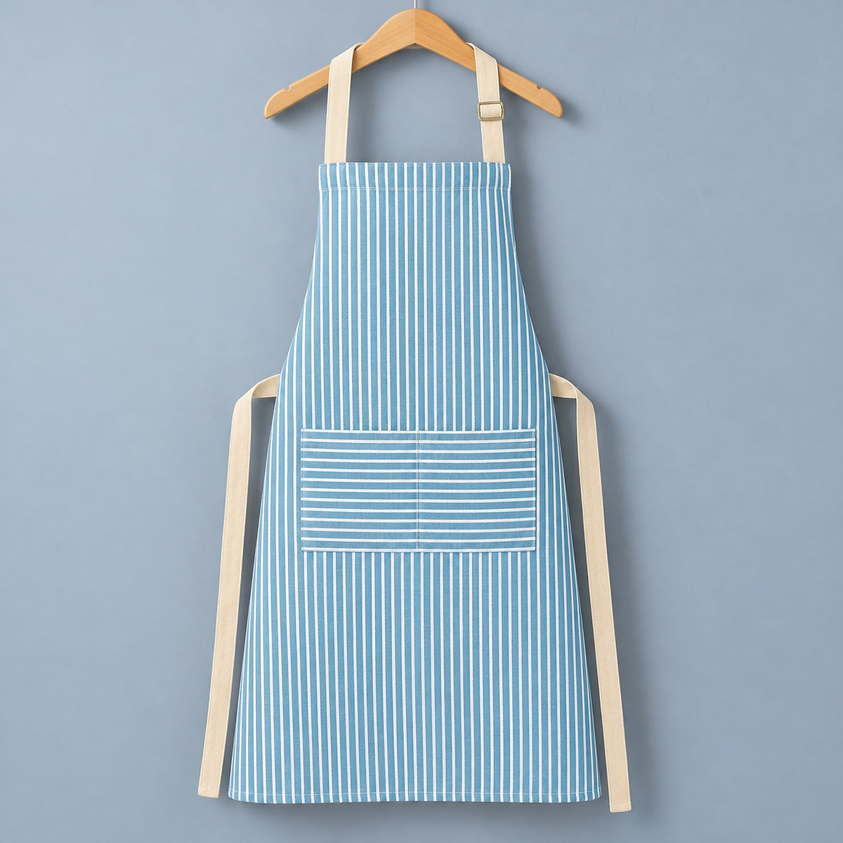 One complete blue striped bib apron with beige neck and waist ties.