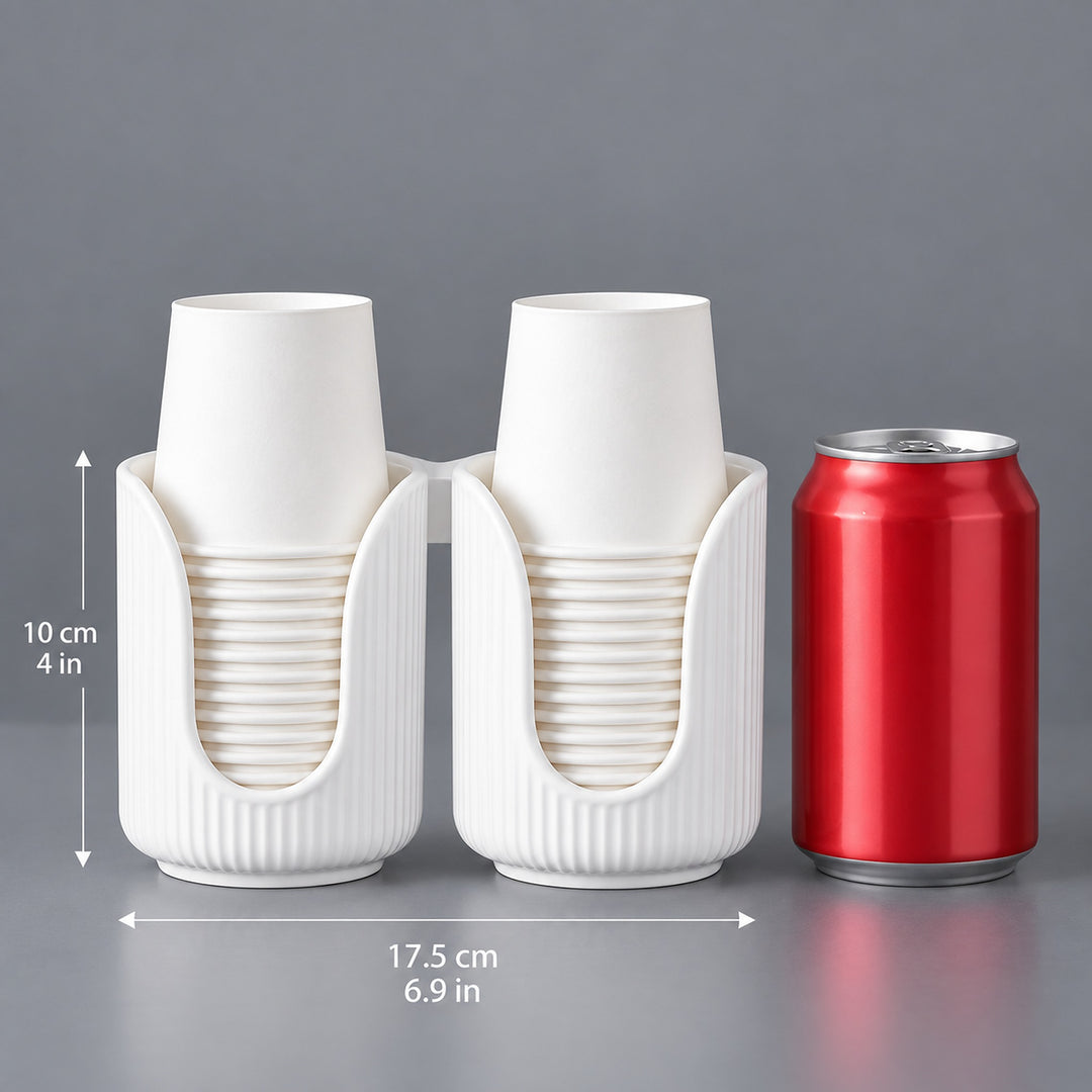 A white dual-cup holder set with two nested paper cups, shown with dimension lines indicating 17.5 cm width and 10 cm height, next to a red soda can for scale on a gray background.