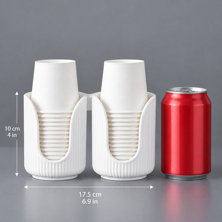 A white dual-cup holder set with two nested paper cups, shown with dimension lines indicating 17.5 cm width and 10 cm height, next to a red soda can for scale on a gray background.