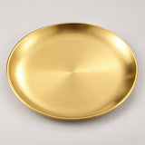 One empty gold stainless steel serving plate with a shallow profile.